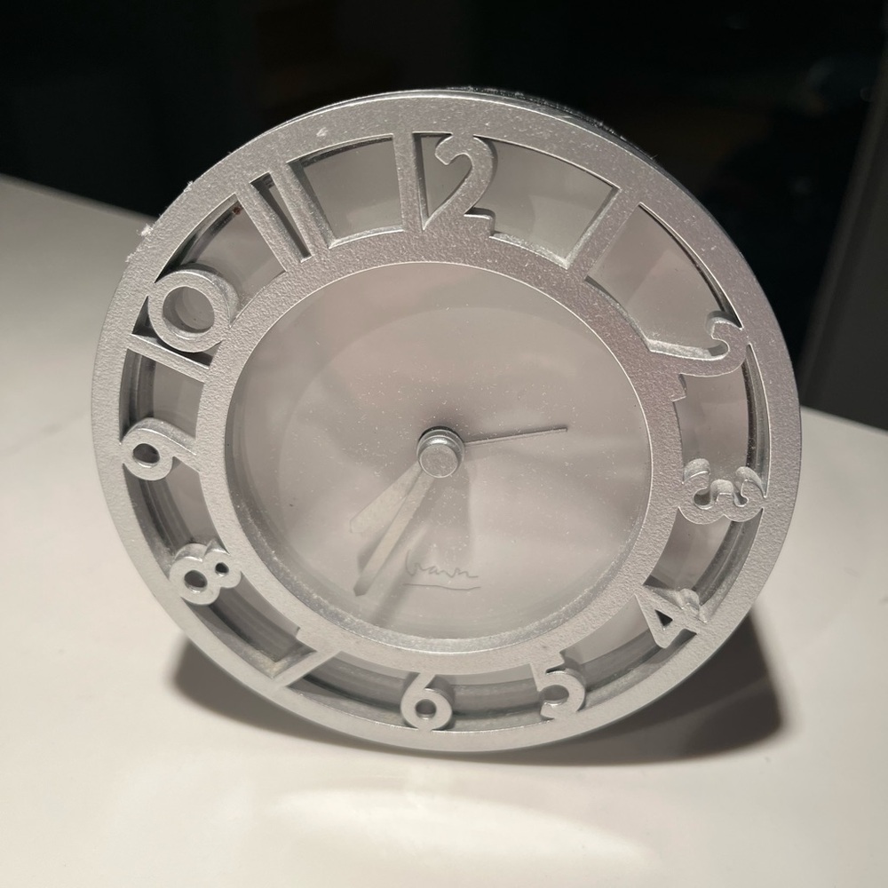 Michael graves alarm clock.  Measures approx 4.25” in diameter.